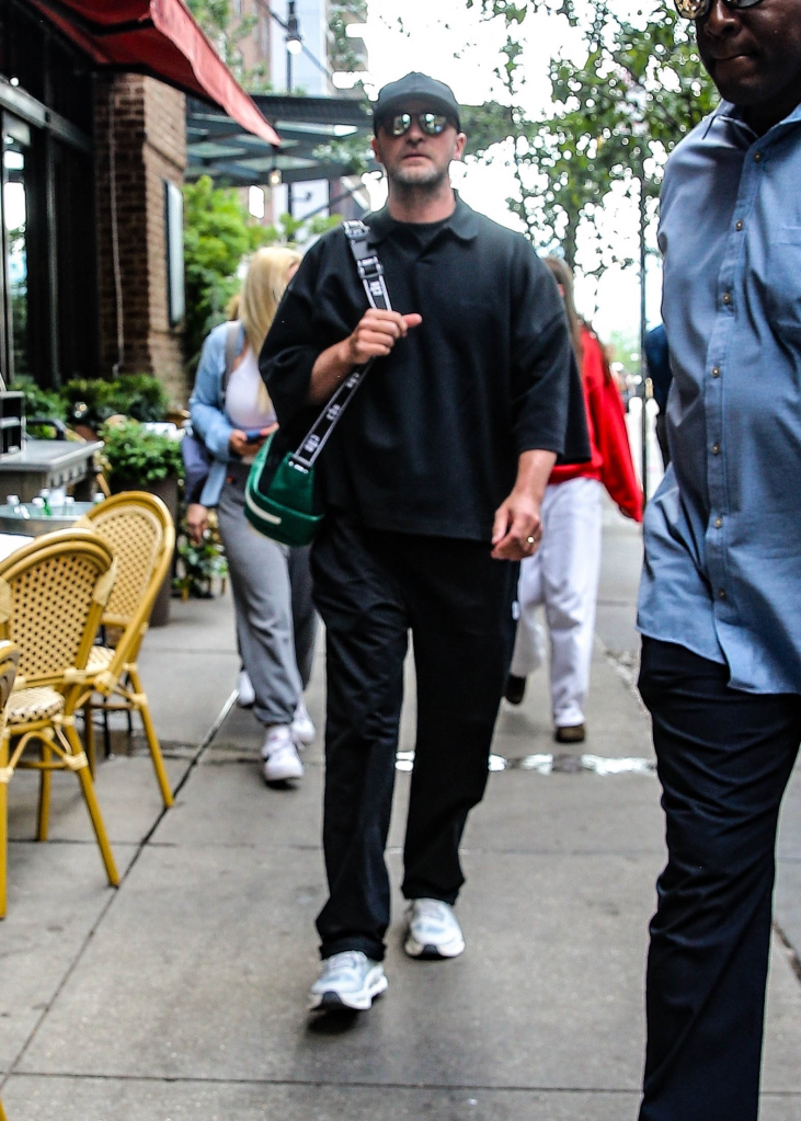 Justin Timberlake in sunglasses and a black hat arriving at the Greenwich Hotel.