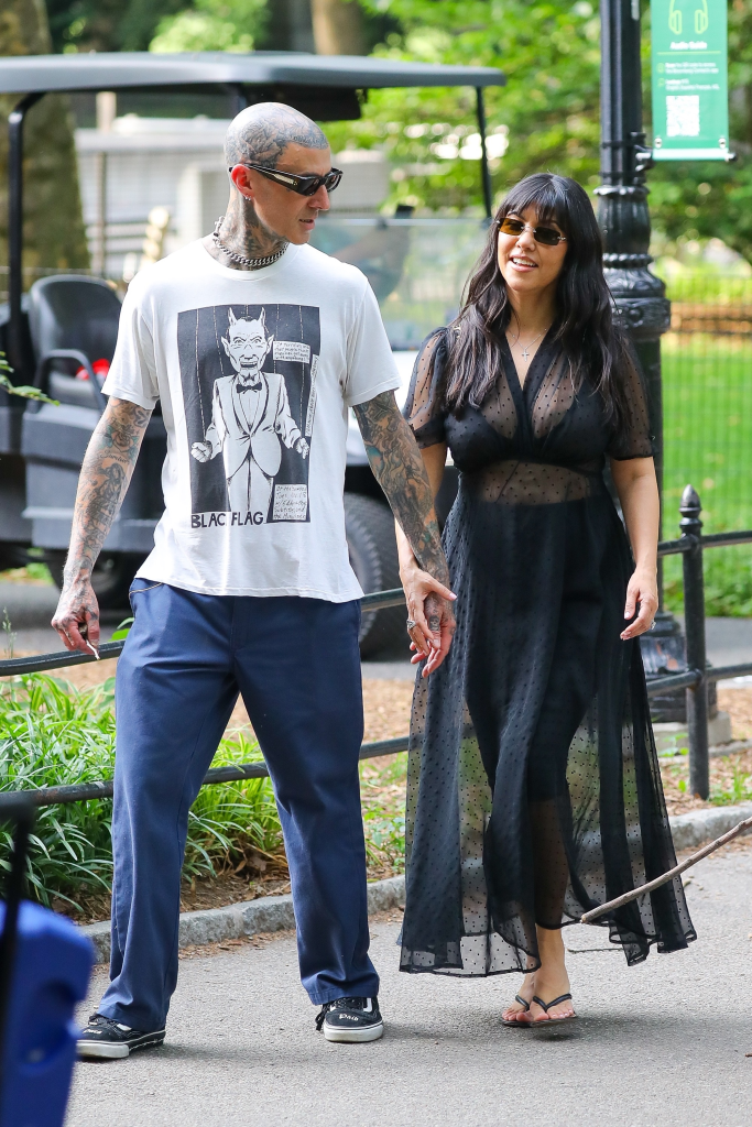 Travis Barker and Kourtney Kardashian holding hands in Central Park, New York.