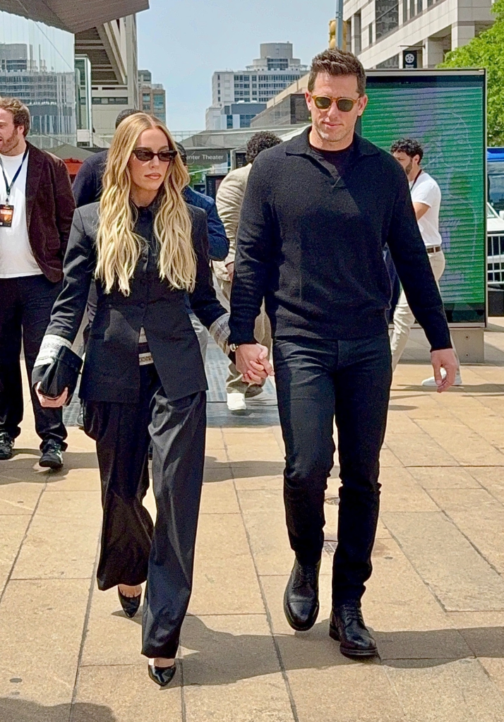 Alexandra Cooper and Matt Kaplan holding hands while walking in New York City.