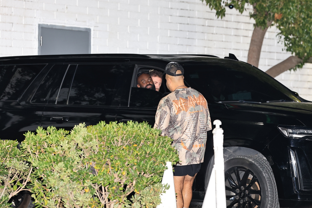 Travis Kelce's friends in a black SUV.