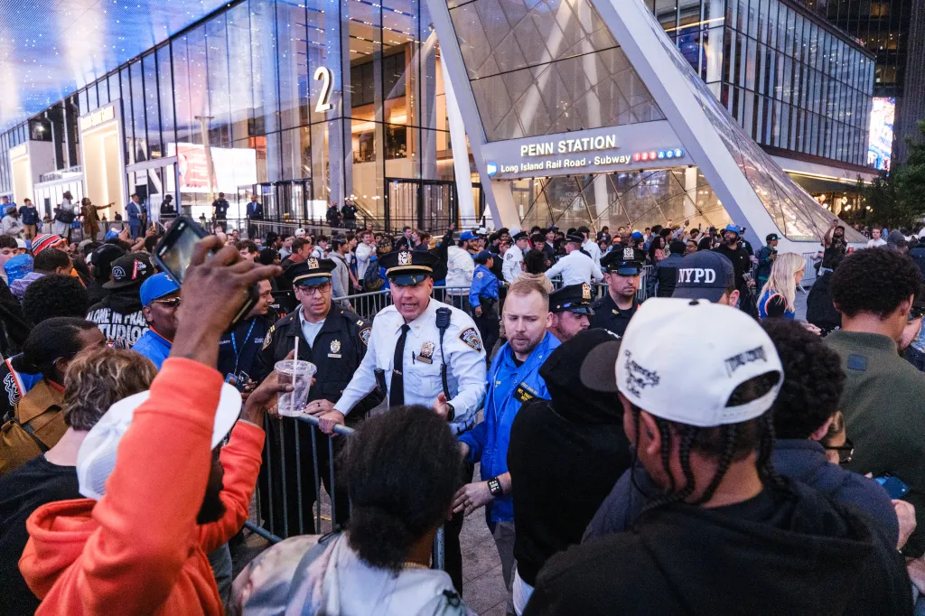 NYPD officers managing a crowd of Knicks fans celebrating outside of Madison Square Garden on May 21, 2026.