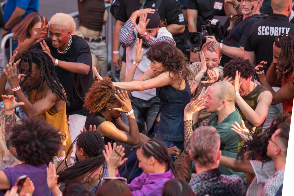 Fans dancing at Madonna's pop-up concert in Times Square.