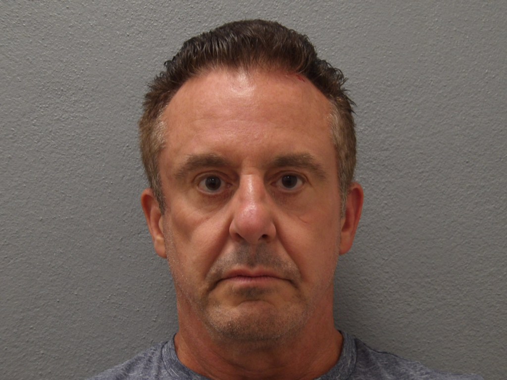 Mugshot of Christopher Michael Veit against a gray background.