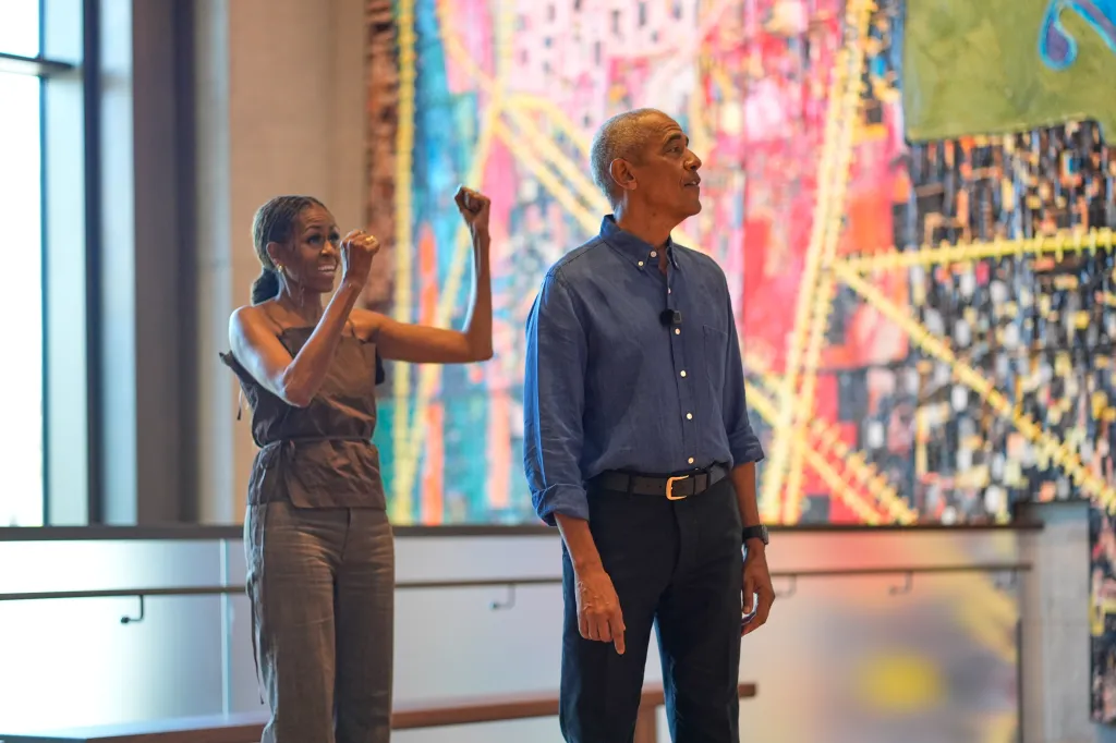 Former President Barack Obama and Michelle Obama greet visitors at the official opening of the Obama Presidential Center on June 19, 2026.