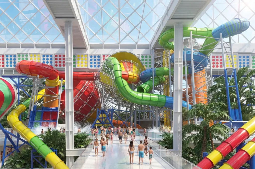 Illustration of a large indoor water park with many colorful slides and people.