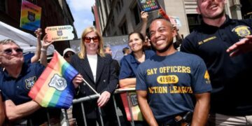 NYPD commish stands with armed gay cops on sidelines of NYC Pride March after slamming organizers for barring them