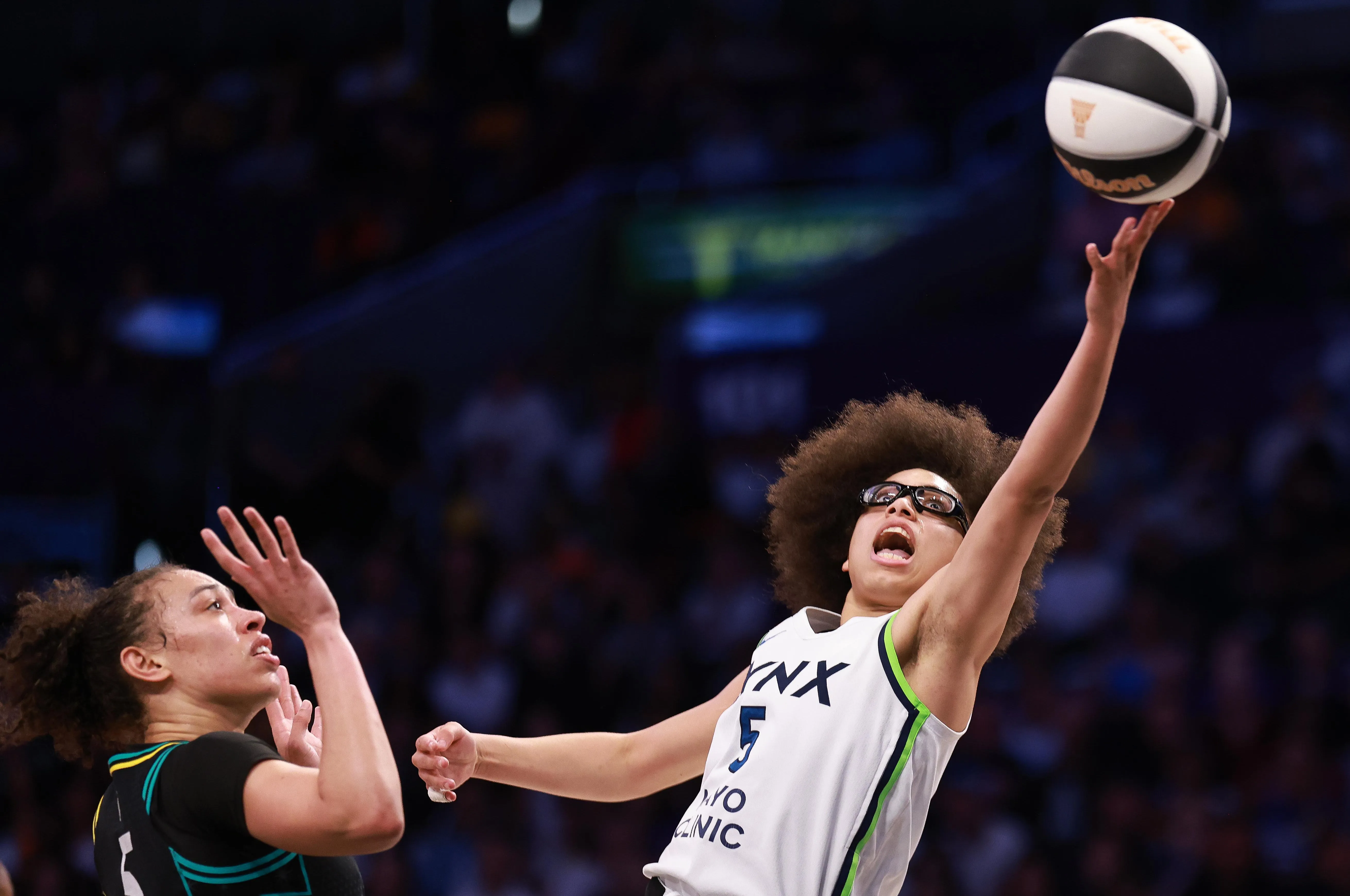 Picture of Minnesota Lynx rookie Olivia Miles going up for a layup