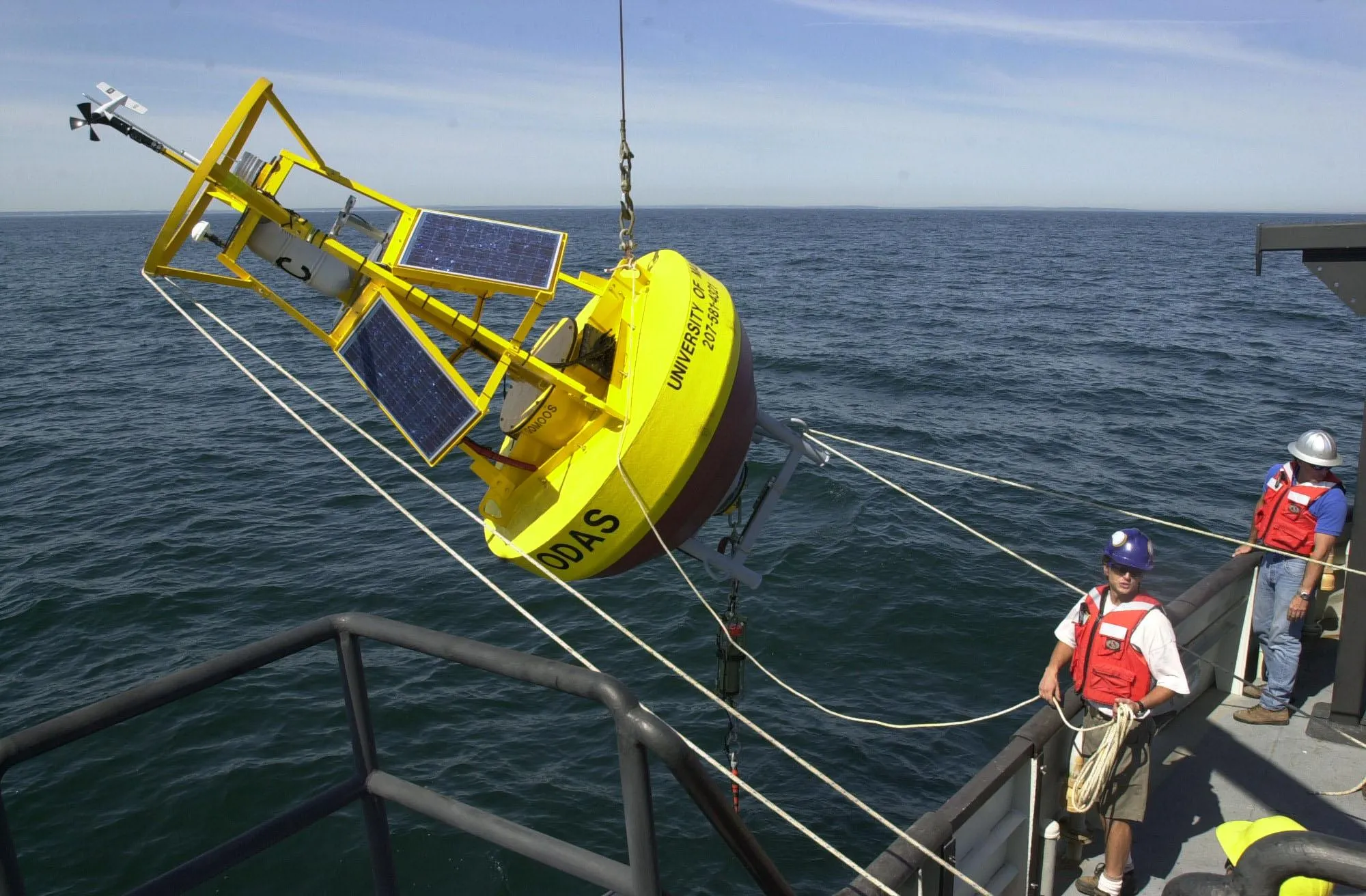 A group of researchers deploy a machine in the ocean