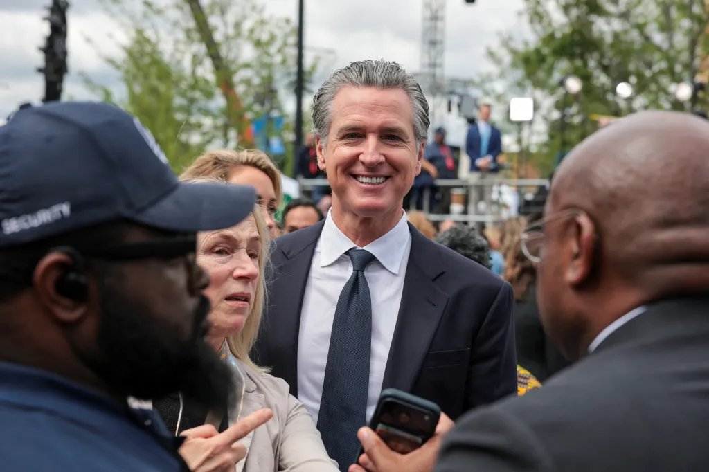 Gavin Newsom smiling at the dedication ceremony for the opening of the Obama Presidential Center.