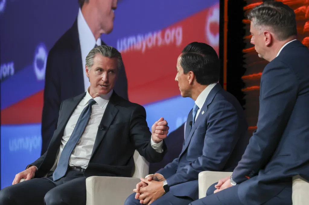 Gavin Newsom speaking at the 94th Annual Meeting of the United States Conference of Mayors in California.
