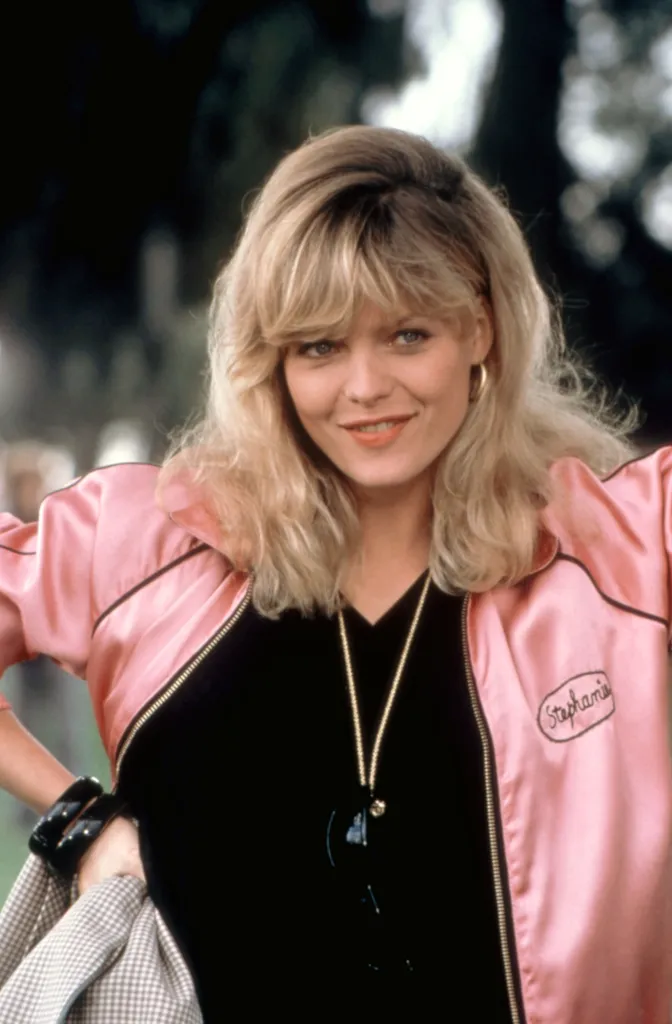 Michelle Pfeiffer in a pink satin jacket with 