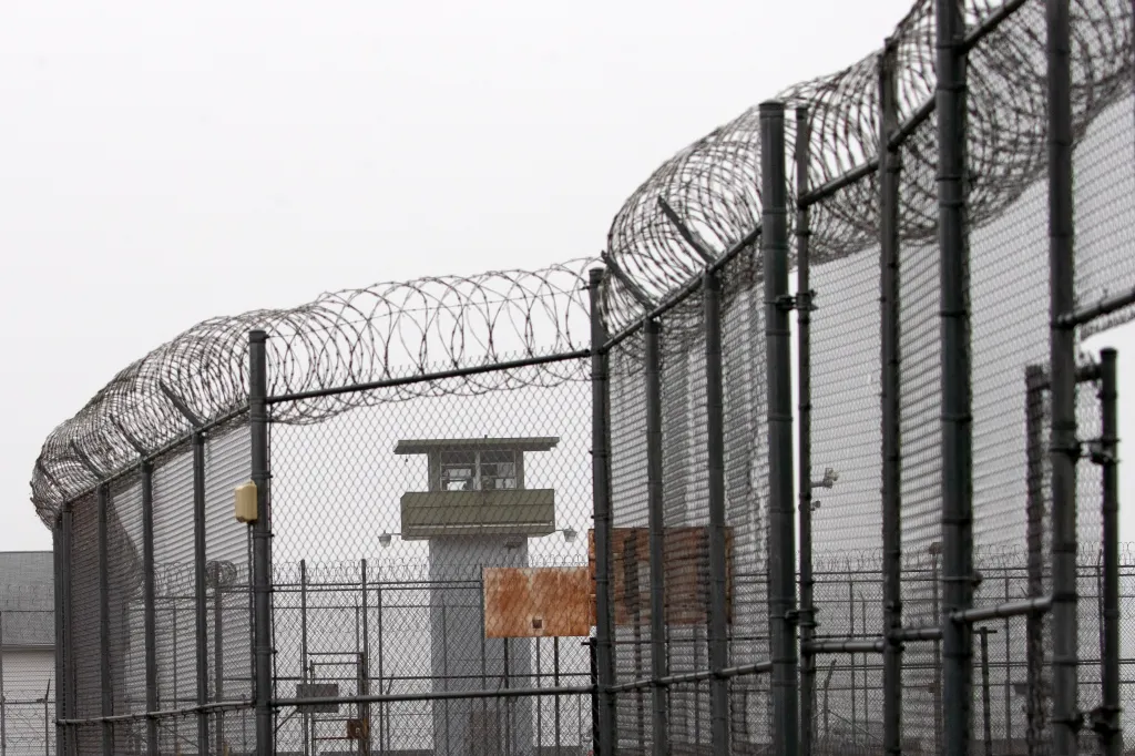A guard tower and barbed wire fending outside Sing Sing Correctional Facility