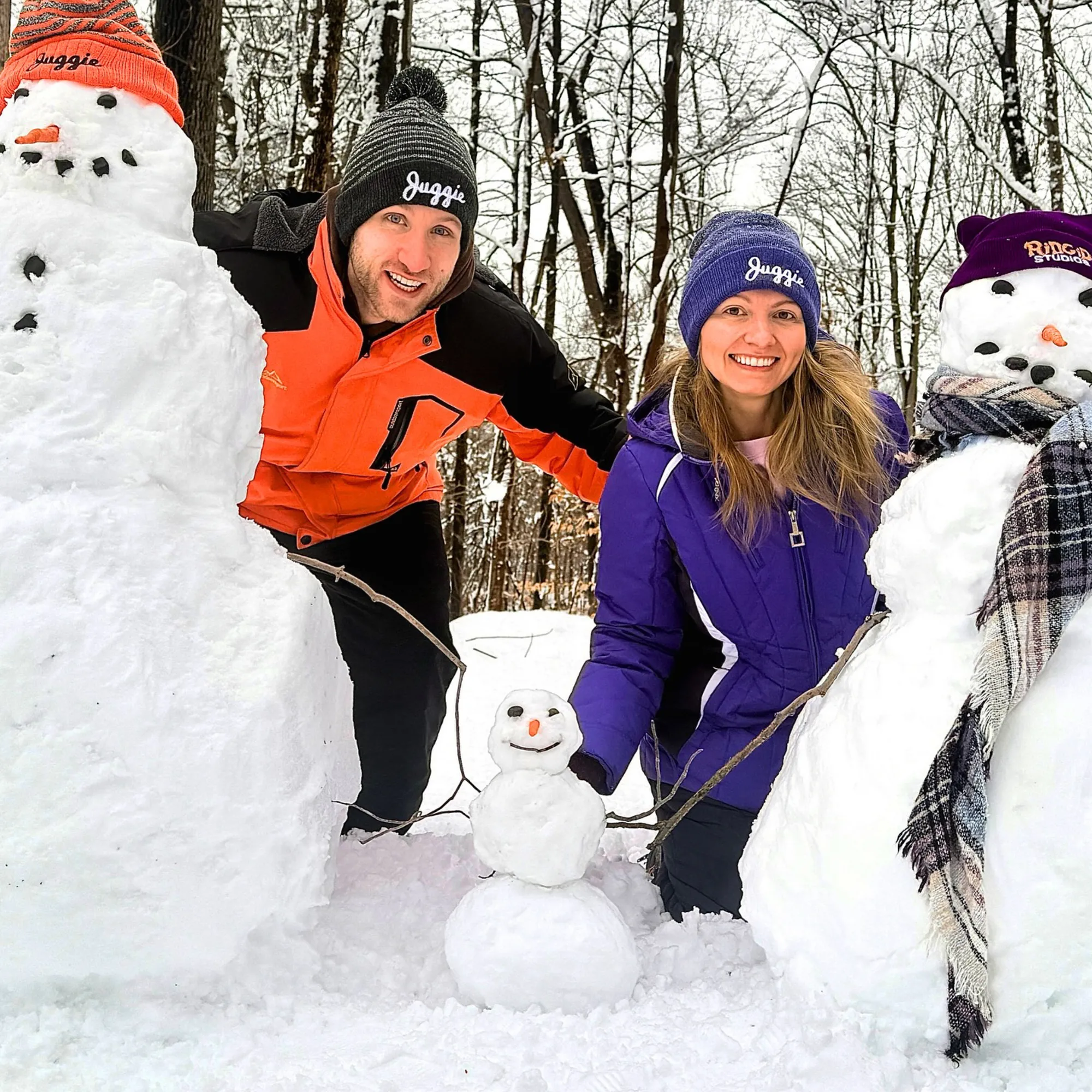 Jesse Ridgway and his wife with snowmen.