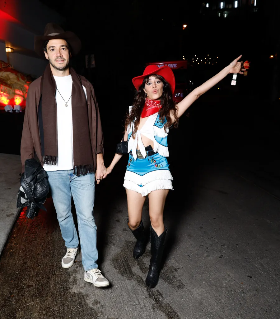 Henry Junior Chalhoub and Camila Cabello in costume at a Halloween party.
