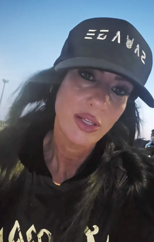 Caregiver Julie Rothgeb wearing a black cap.