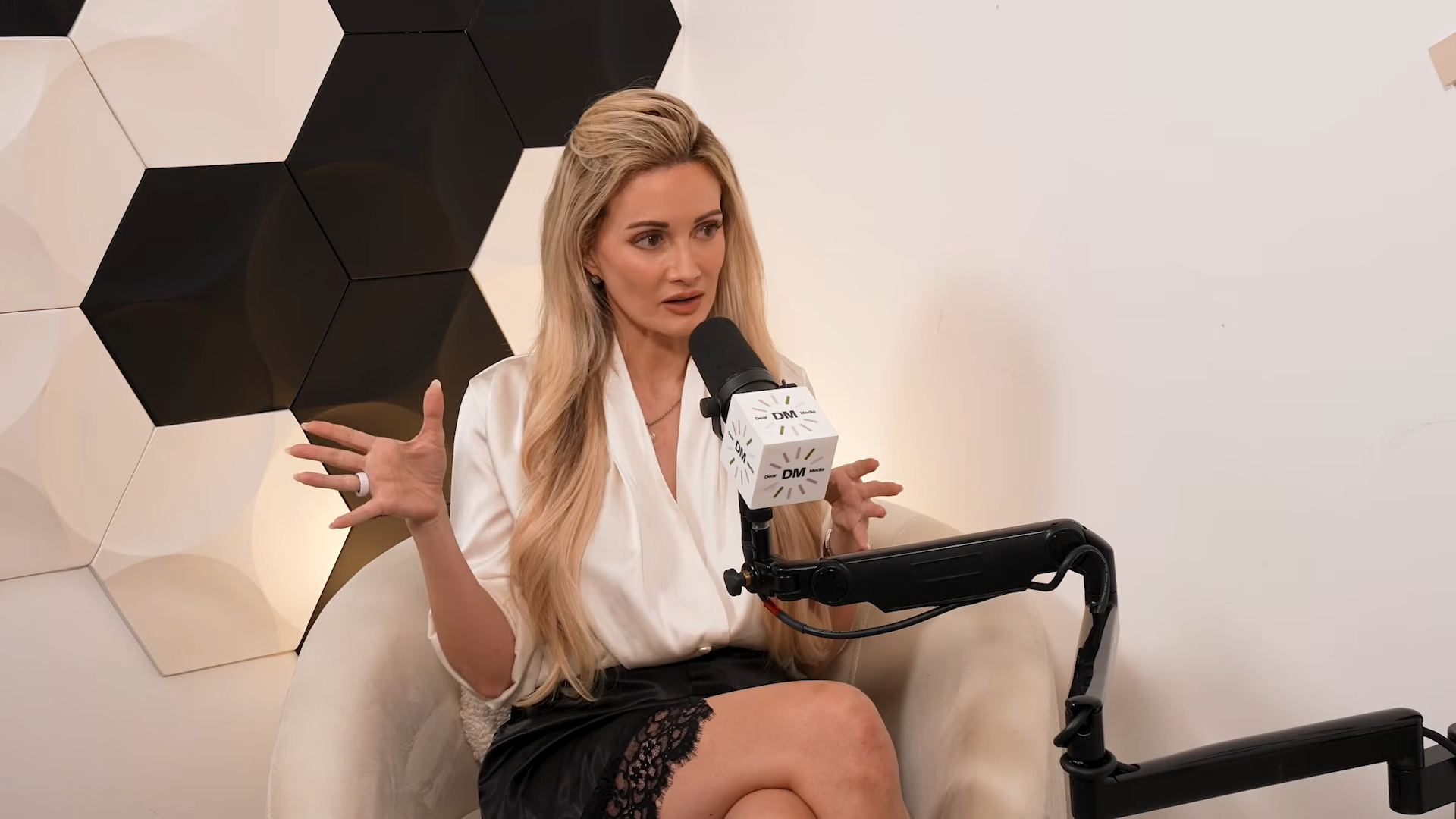 Holly Madison speaking on the Derm Approved podcast.