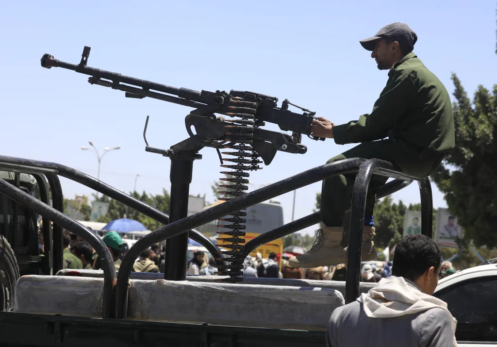 A Houthi soldier operates a machine gun mounted on a vehicle in Sana'a, Yemen.