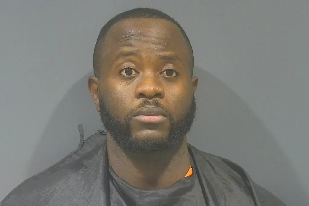 Mugshot of Indiana police officer Simni Osomuide arrested for sexual assault.