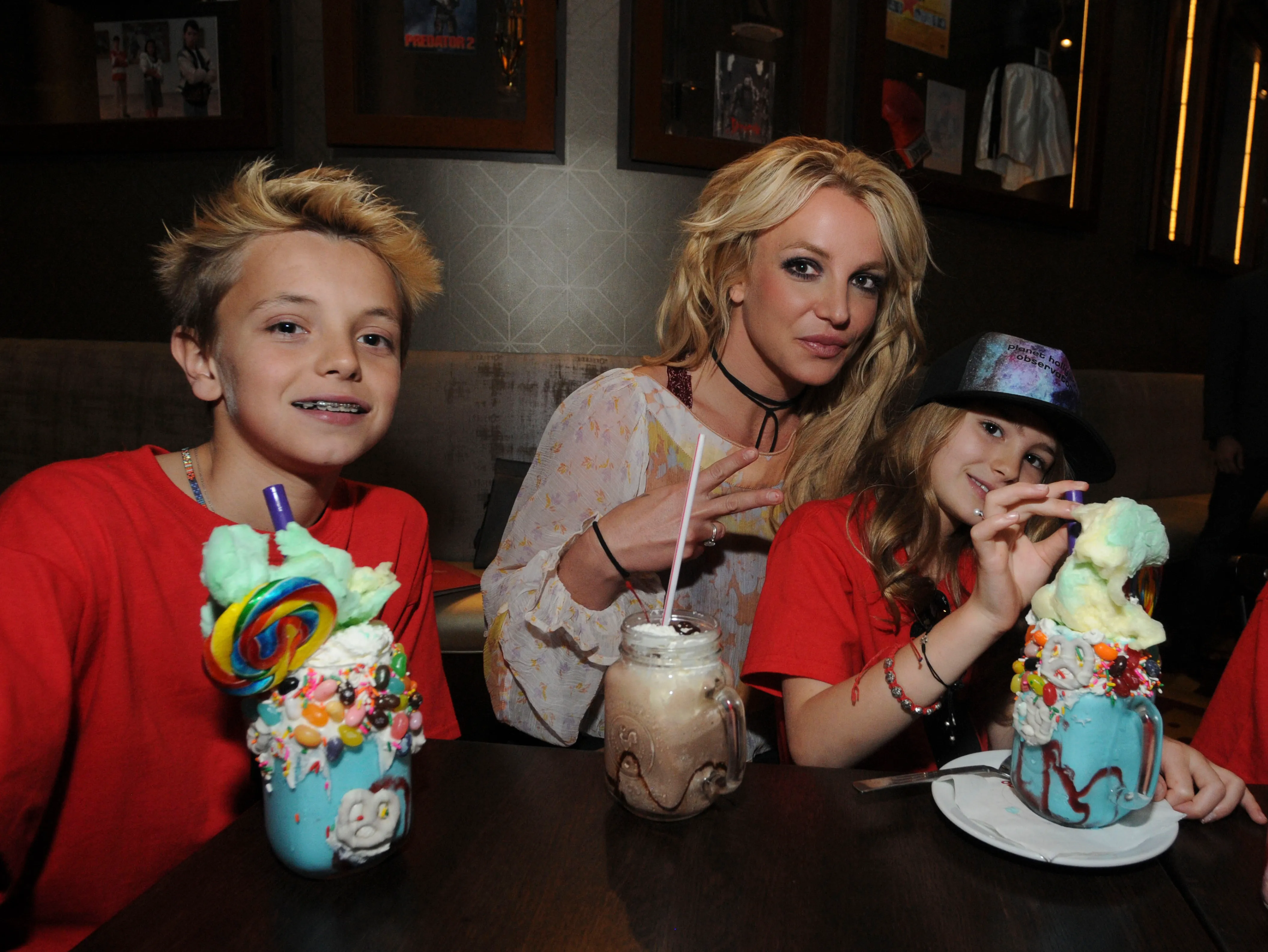 Britney Spears with Jayden Federline and Maddie Aldridge at Planet Hollywood Disney Springs.