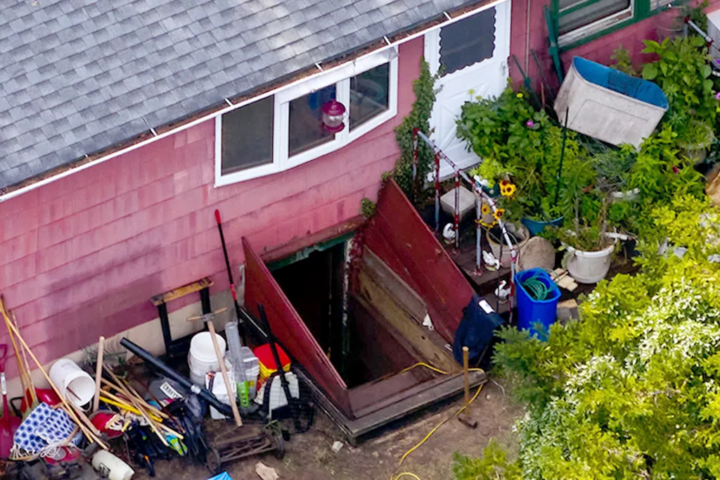 Crime scene investigators collect evidence from a shed and backyard of Gilgo Beach murders suspect Rex Heuermann's house.