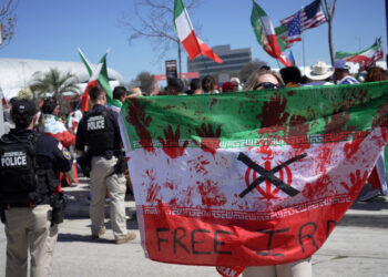 Support for Iran’s team – but not for regime