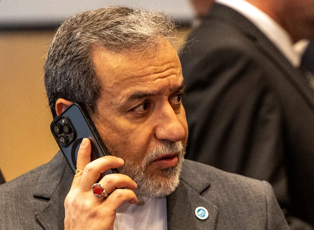 Iranian Foreign Minister Abbas Araghchi making a phone call during the 51st Session of the Council of Foreign Ministers of the Organisation of Islamic Cooperation (OIC) in Istanbul.
