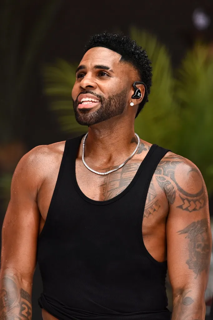 Jason Derulo performing on stage.