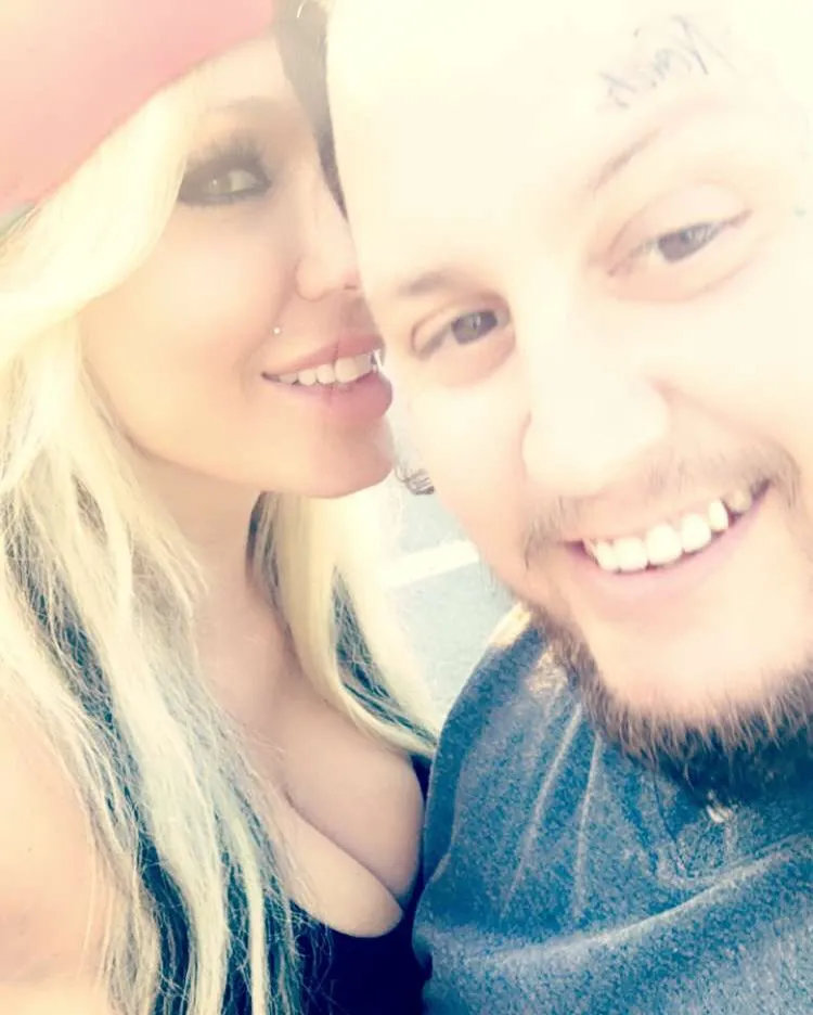 Jelly Roll and Bunnie Xo smiling together.