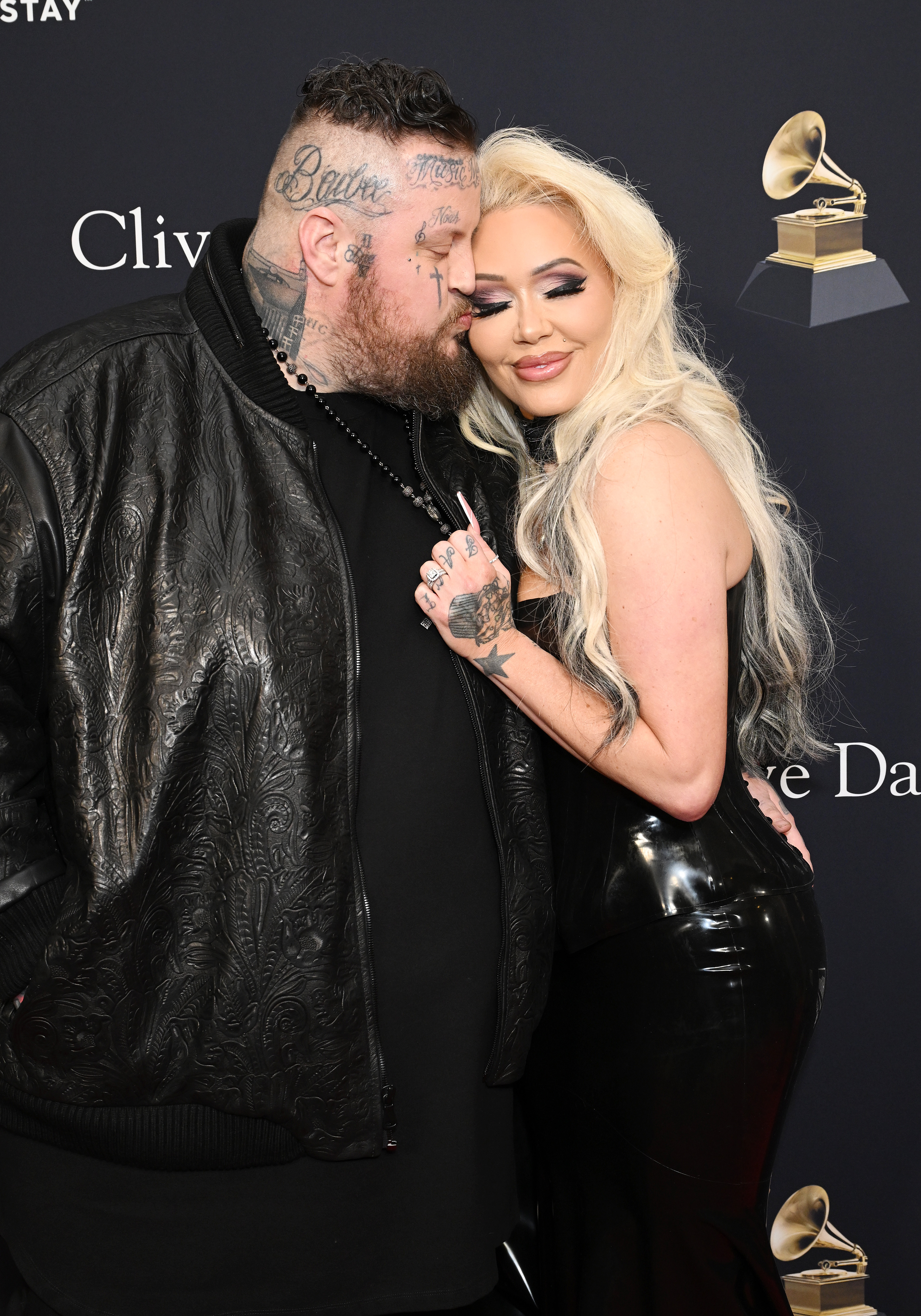 Jelly Roll and Bunnie XO embrace on the red carpet of the Pre-GRAMMY Gala.