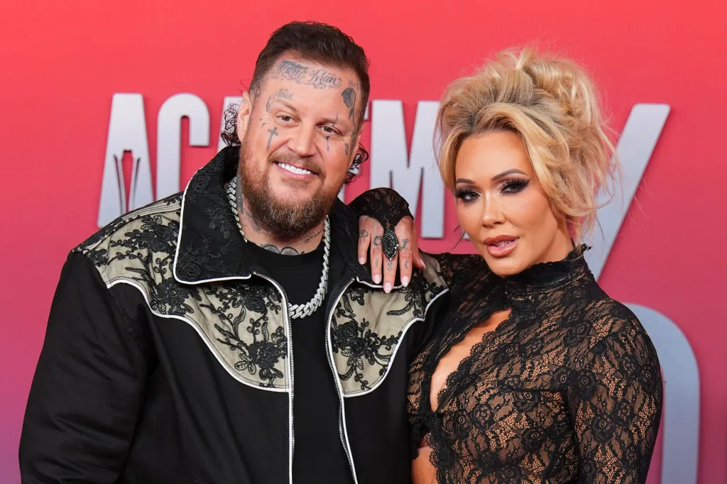 Jelly Roll and Bunnie XO posing together at the Academy of Country Music Awards.