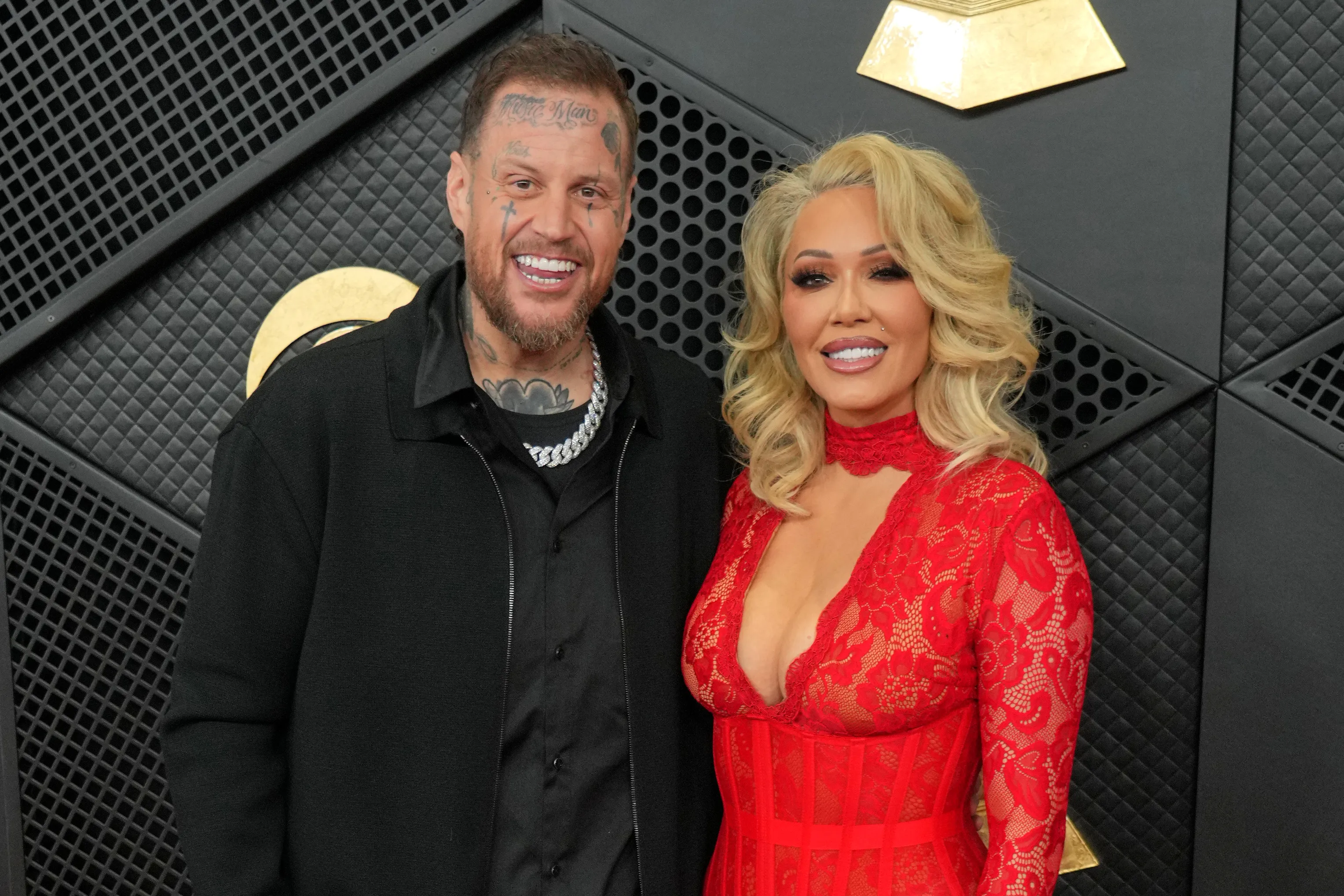 Jelly Roll and Bunnie XO smile at the Grammy Awards.