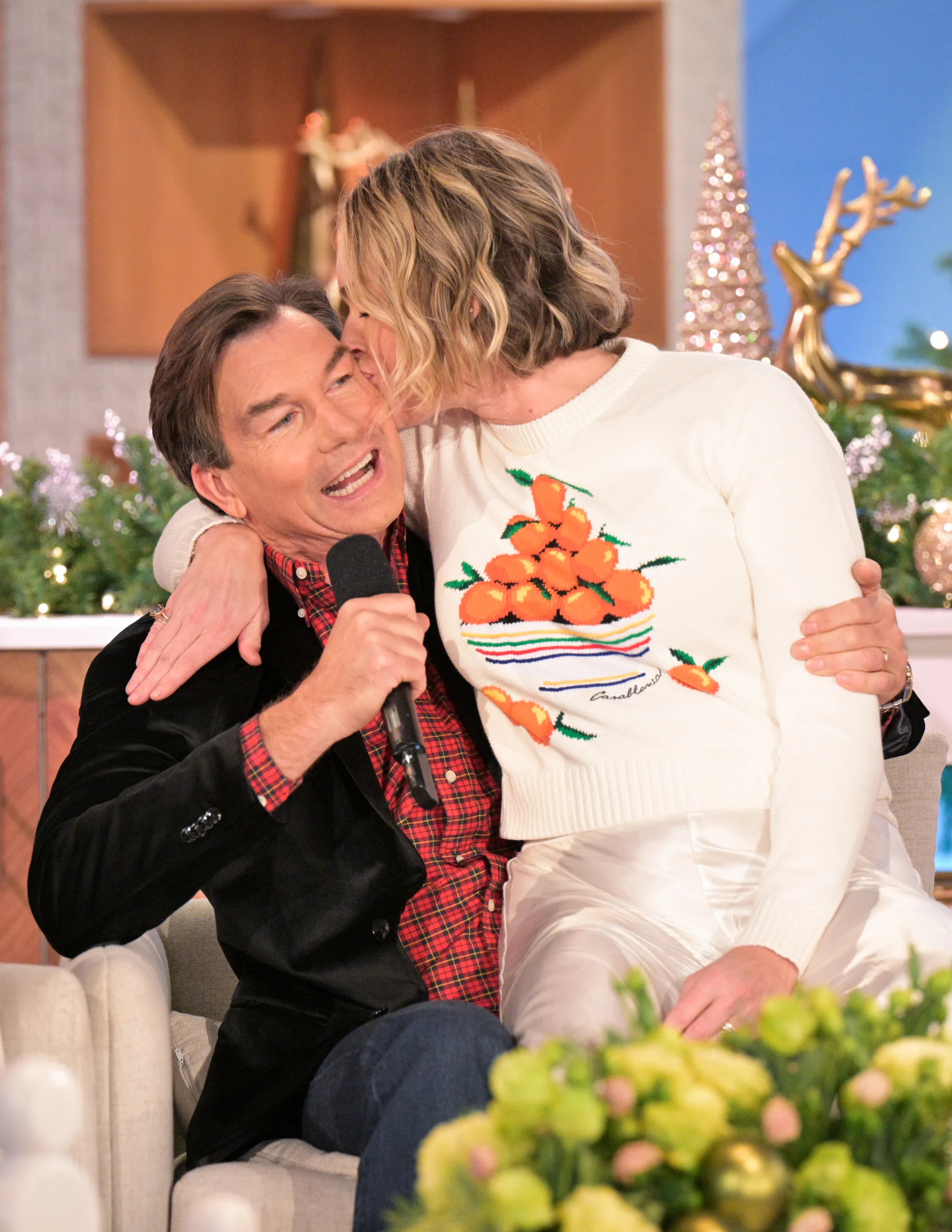 Rebecca Romijn kisses Jerry O'Connell on the cheek on The Talk.