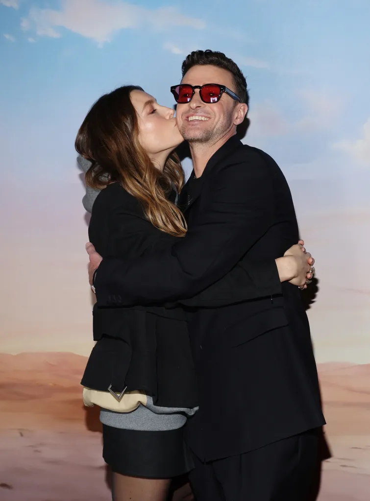 Jessica Biel kissing Justin Timberlake on the cheek.