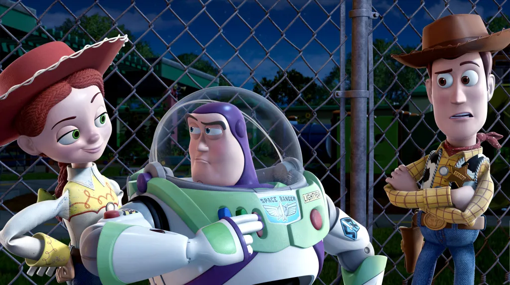 Illustration of Jessie, Buzz Lightyear, and Woody from Toy Story 3 standing behind a fence.