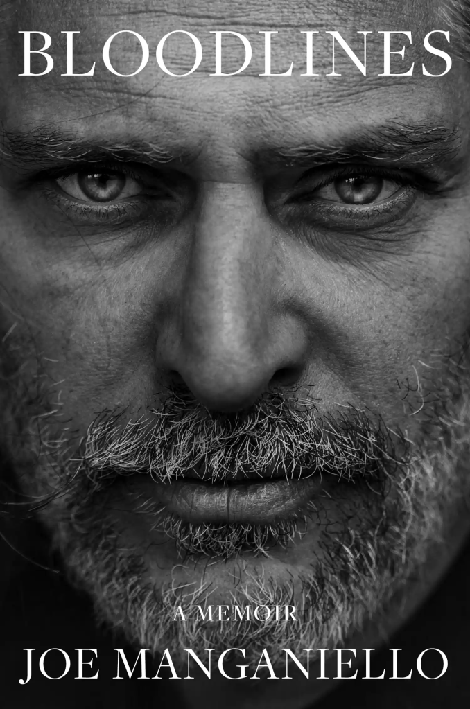 Black and white close-up of Joe Manganiello's face, with a greying beard and intense stare, on the cover of his memoir, 