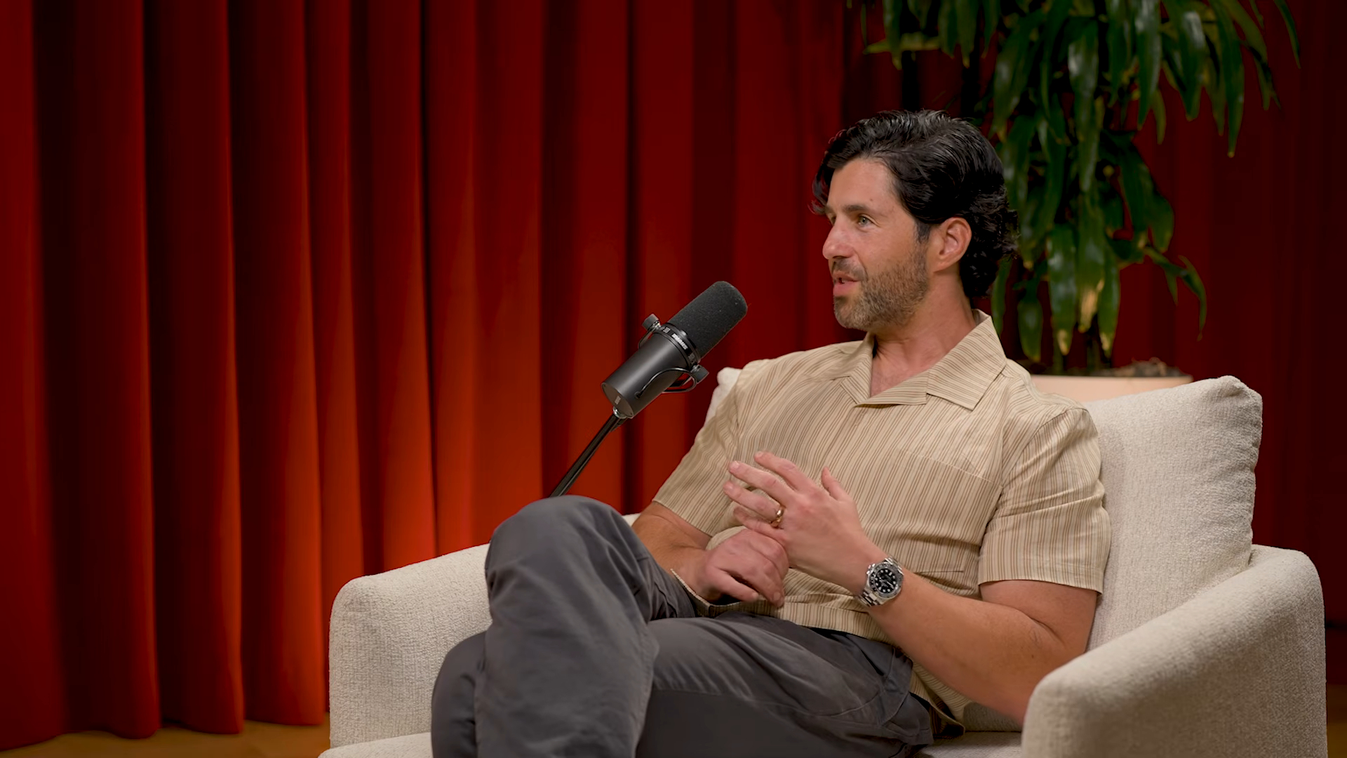 Josh Peck speaking into a microphone.