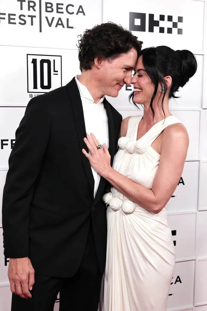 Justin Trudeau and Katy Perry smiling, touching noses at the Tribeca Festival.
