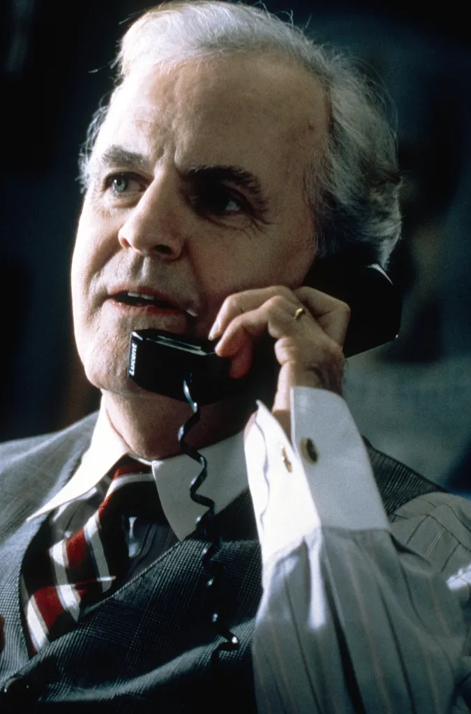Portrait of James Handy from the movie K-911, talking on a telephone.