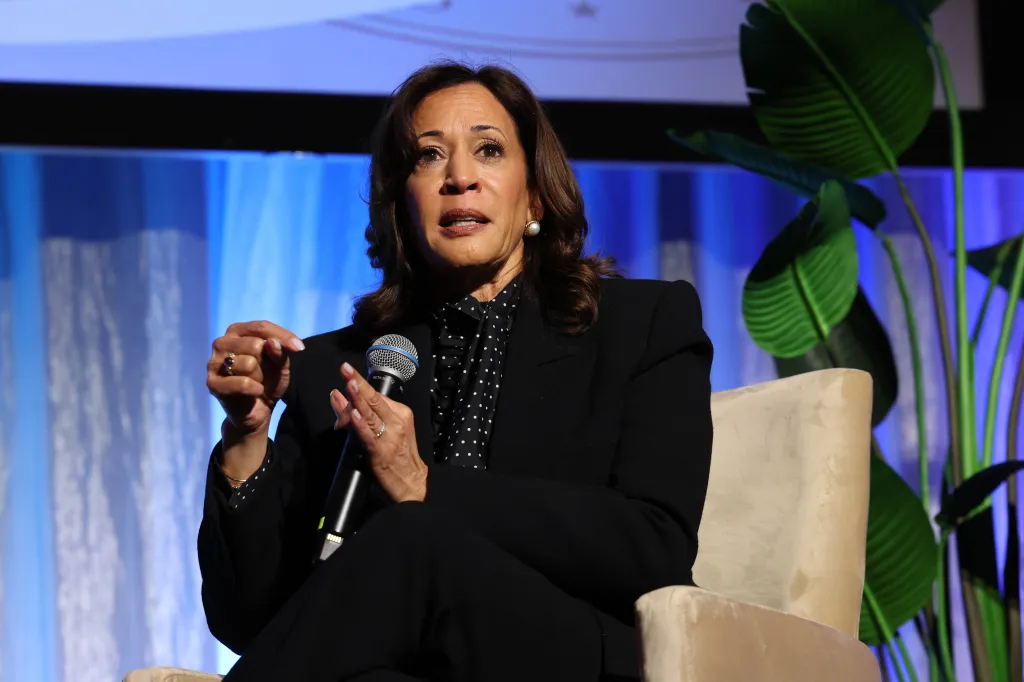 Kamala Harris speaks into a microphone at the Public Counsel Awards Dinner.