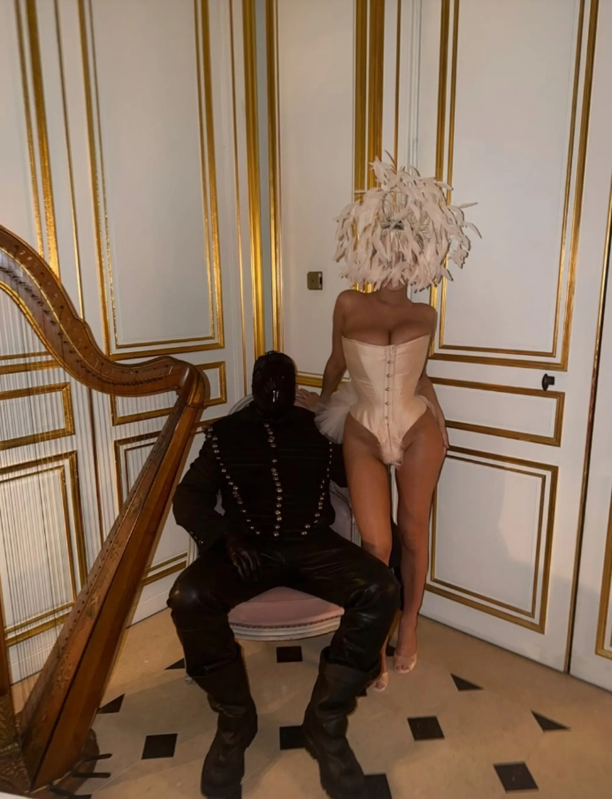 Kanye West and Bianca Censori in masquerade-themed outfits.