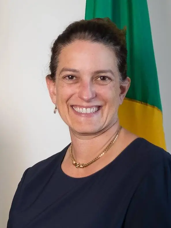 Katharine Elizabeth Young Yaroslavsky smiling in a dark blue top and a gold necklace.