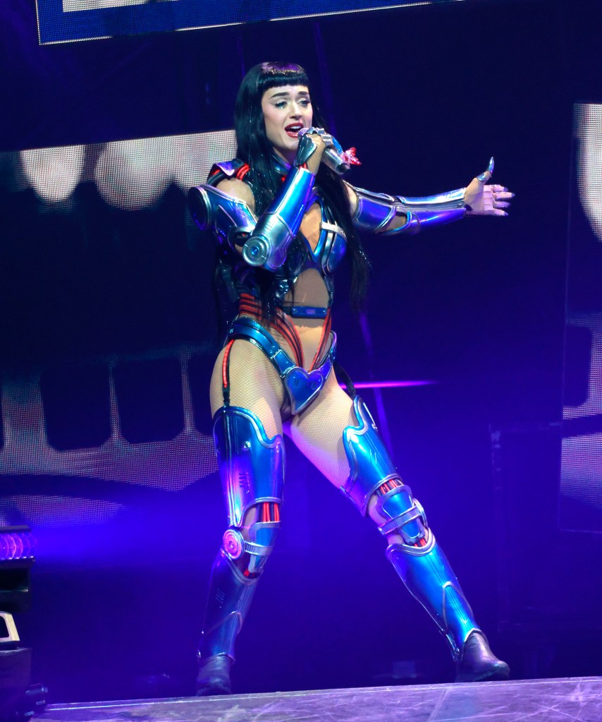 Katy Perry performing in a blue and silver futuristic costume.