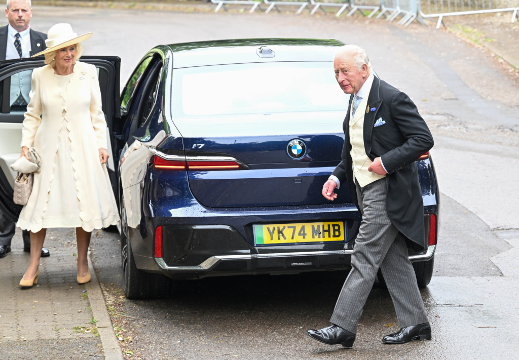 Queen Camilla and King Charles III arriving at All Saints' Church in Kemble for a wedding.