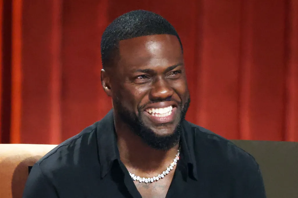 Kevin Hart smiling onstage during Netflix Is A Joke Festival Presents: The Roast of Kevin Hart.