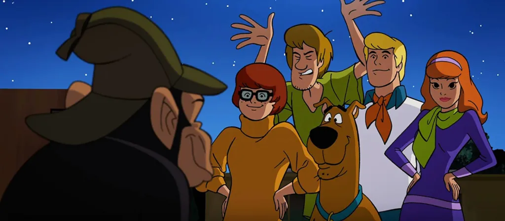 Illustration of Detective Chimp facing Velma, Shaggy, Scooby-Doo, Fred, and Daphne.