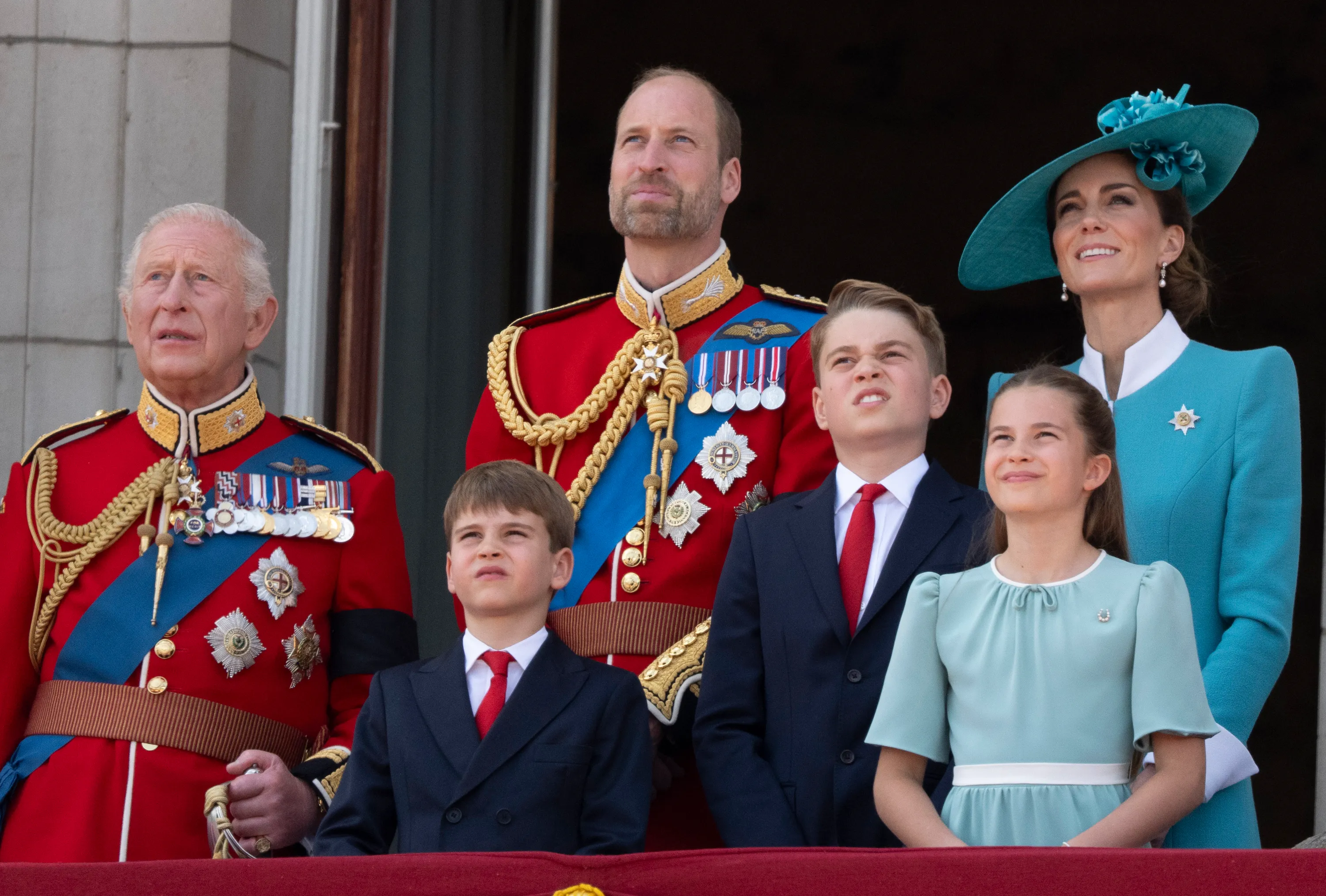 King Charles III, Prince William, Catherine, Princess of Wales, and their children Prince George, Princess Charlotte, and Prince Louis at Trooping the Colour.