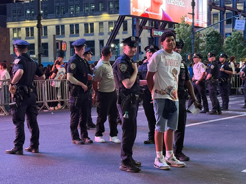 Knicks fan being arrested near Madison Square Garden.