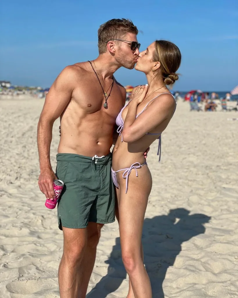 Kyle Cooke and Amanda Batula kissing on a beach.