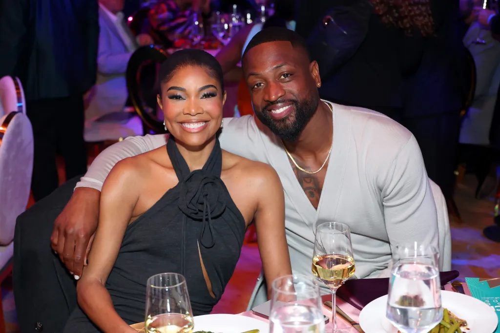 Gabrielle Union and Dwyane Wade smiling at the NAACP Image Awards Dinner.