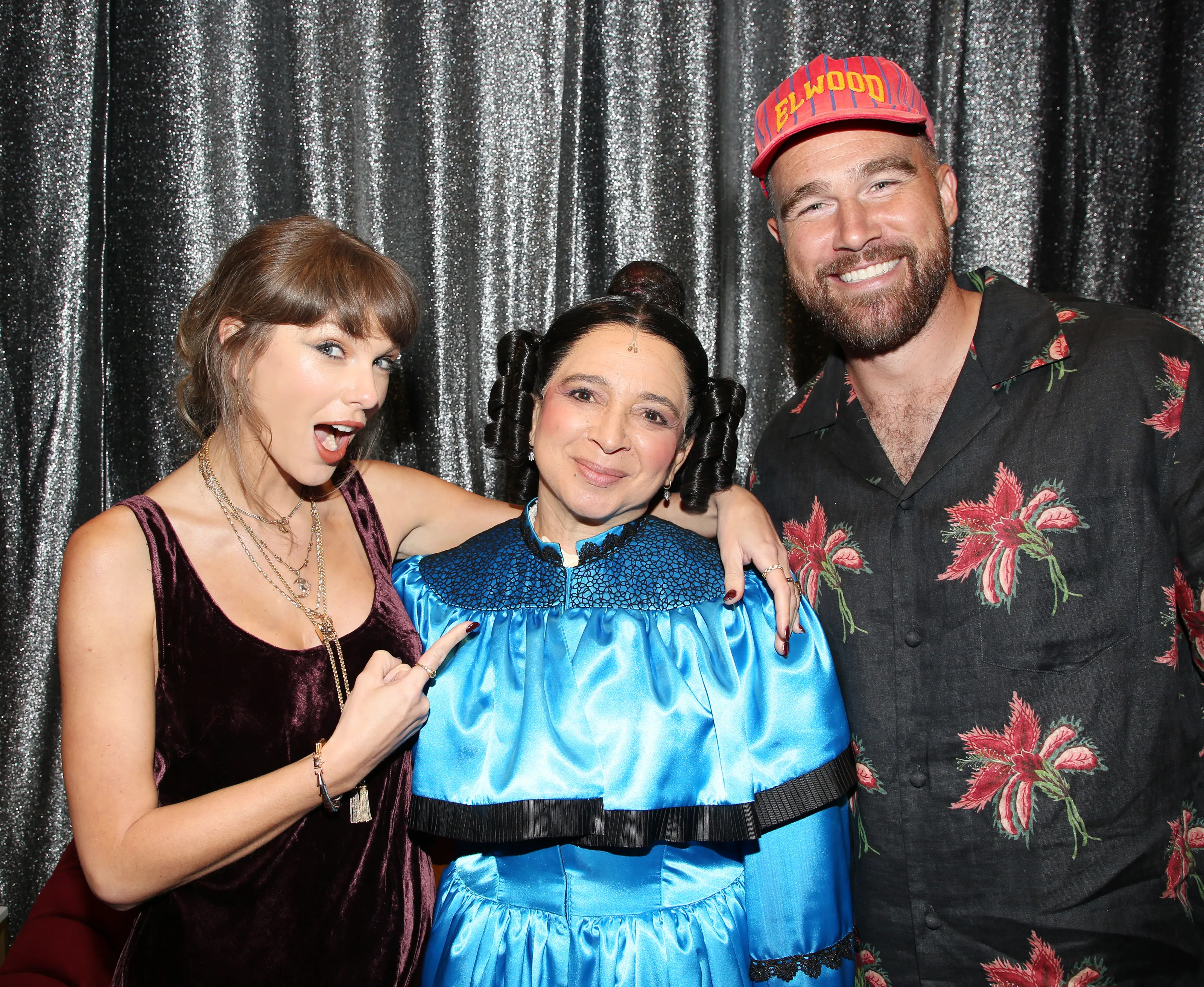 Taylor Swift, Maya Rudolph, and Travis Kelce pose for a photo backstage at the hit comedy 